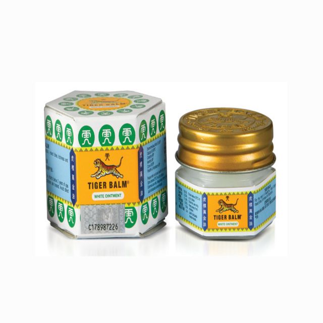 Tiger Balm White 10g ointment in a hexagonal jar for effective pain relief and soothing topical application